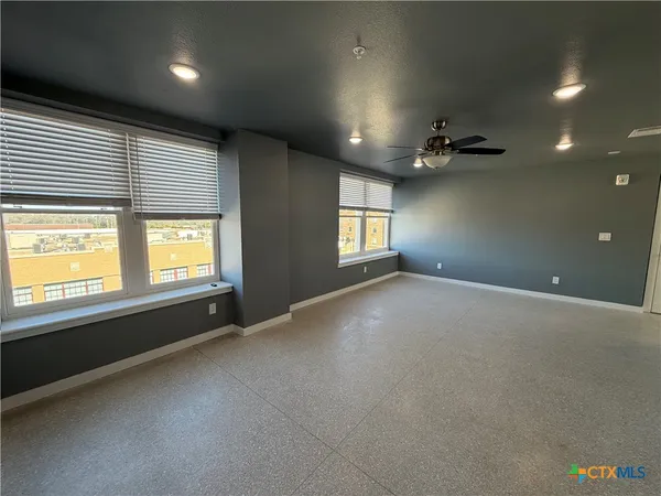 a view of an empty room with a window