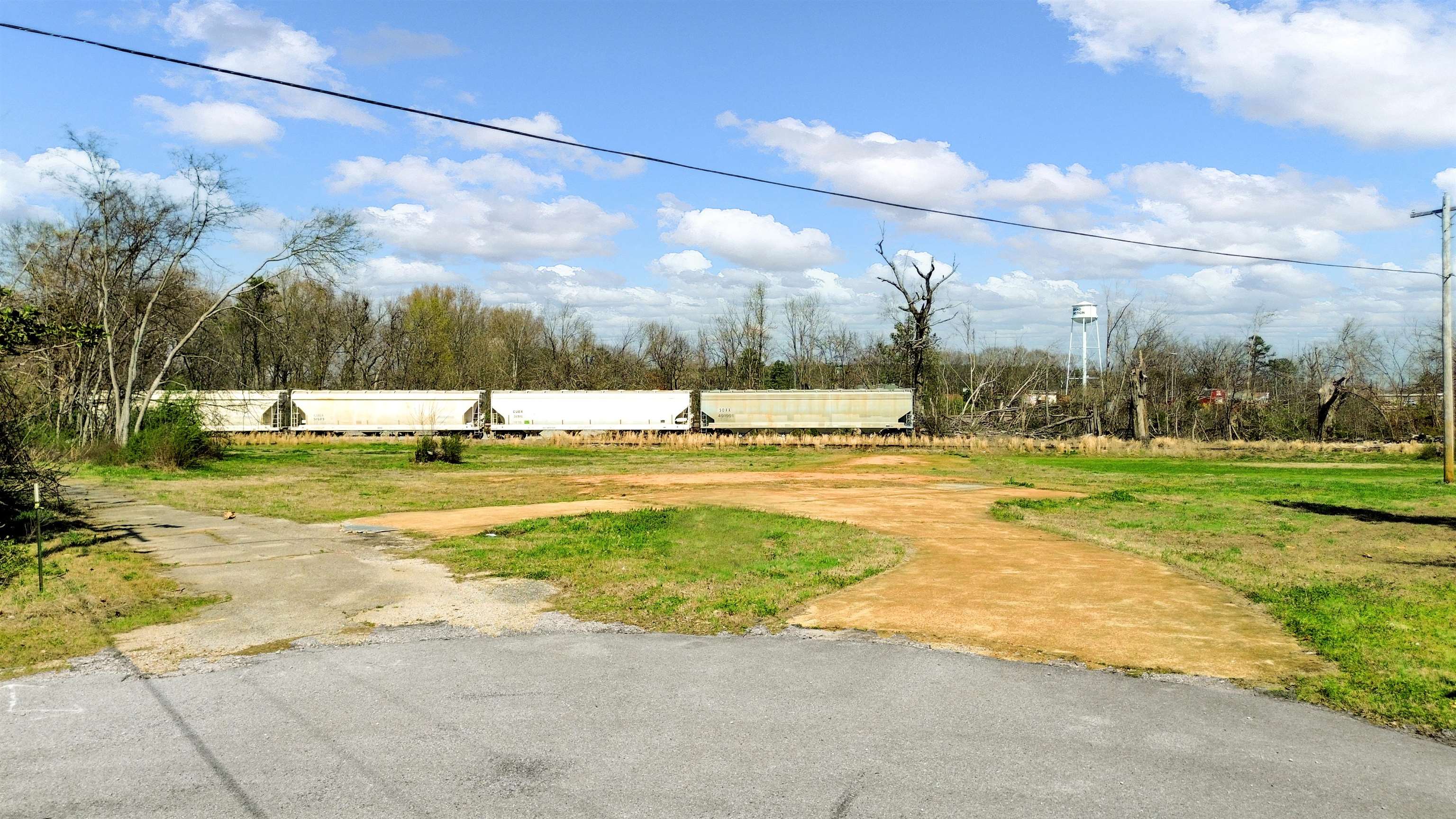 108 Jackson Street Grand Junction, TN 38039 - Photo 3 of 7 a view of a building with a big yard