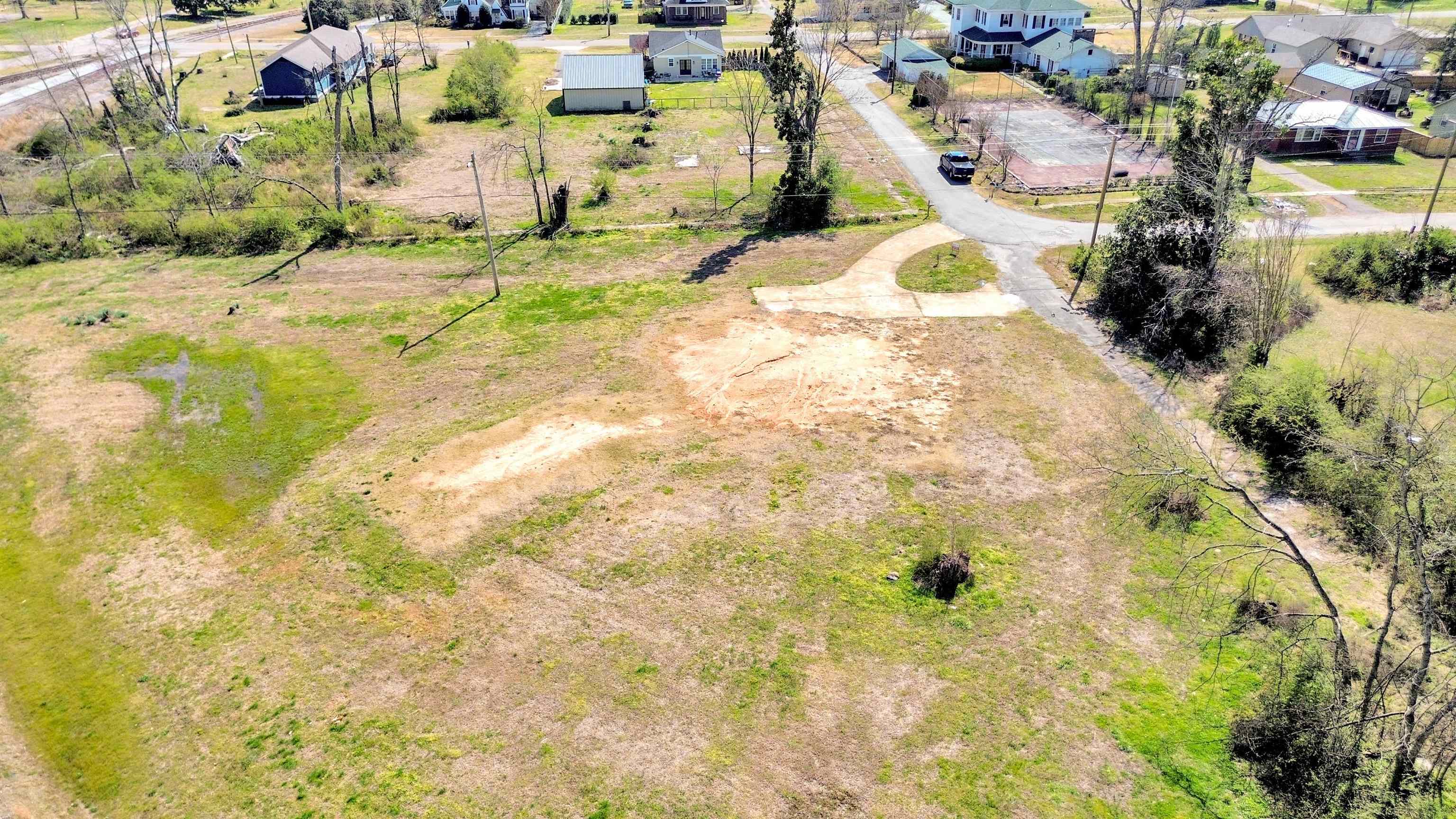 108 Jackson Street Grand Junction, TN 38039 - Photo 6 of 7 a view of a swimming pool with a yard