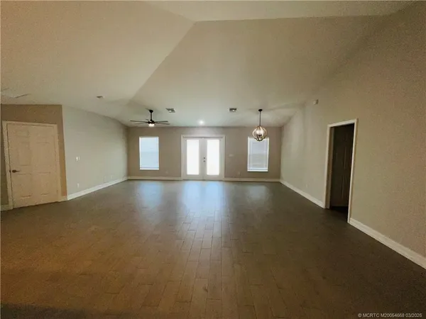 a view of livingroom and hall with wooden floor