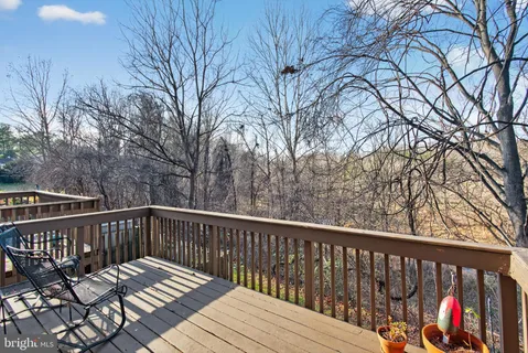 a view of wooden deck and a trees