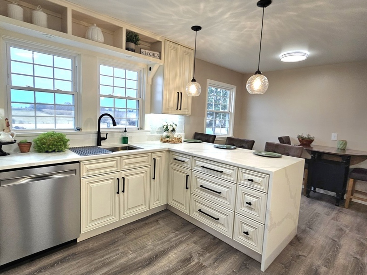 17954 East 10500N Road Grant Park, IL 60940 - Photo 13 of 37 a kitchen that has a lot of cabinets in it and wooden floors