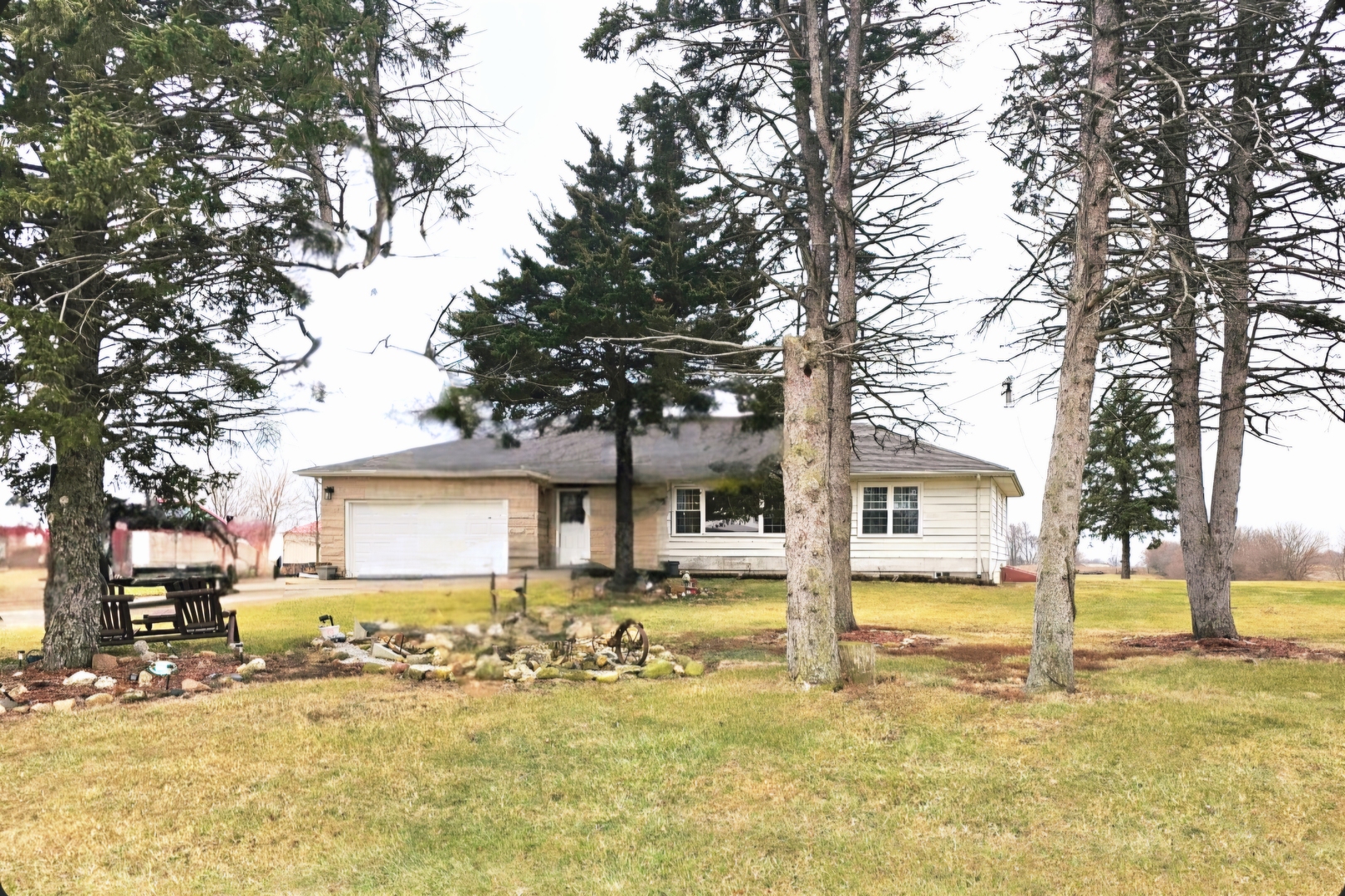17954 East 10500N Road Grant Park, IL 60940 - Photo 2 of 37 a front view of a house with a yard covered with snow and trees