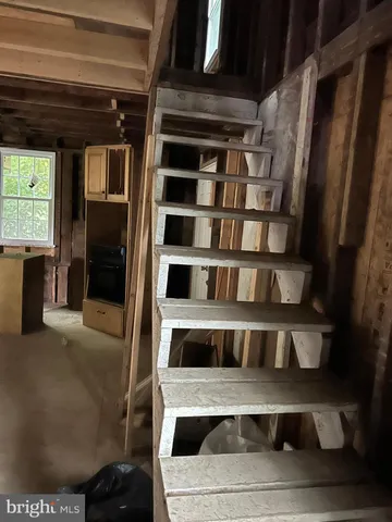 a brick house with a tree in front of it