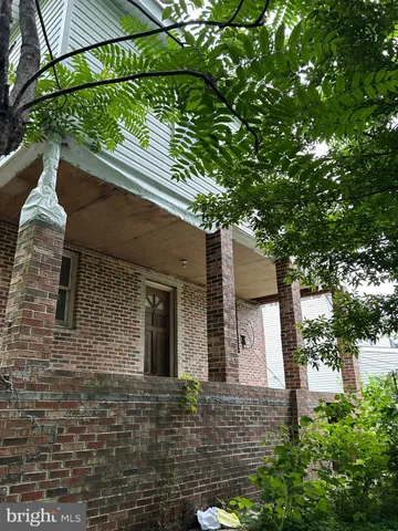 a view of a garden with a building in the background