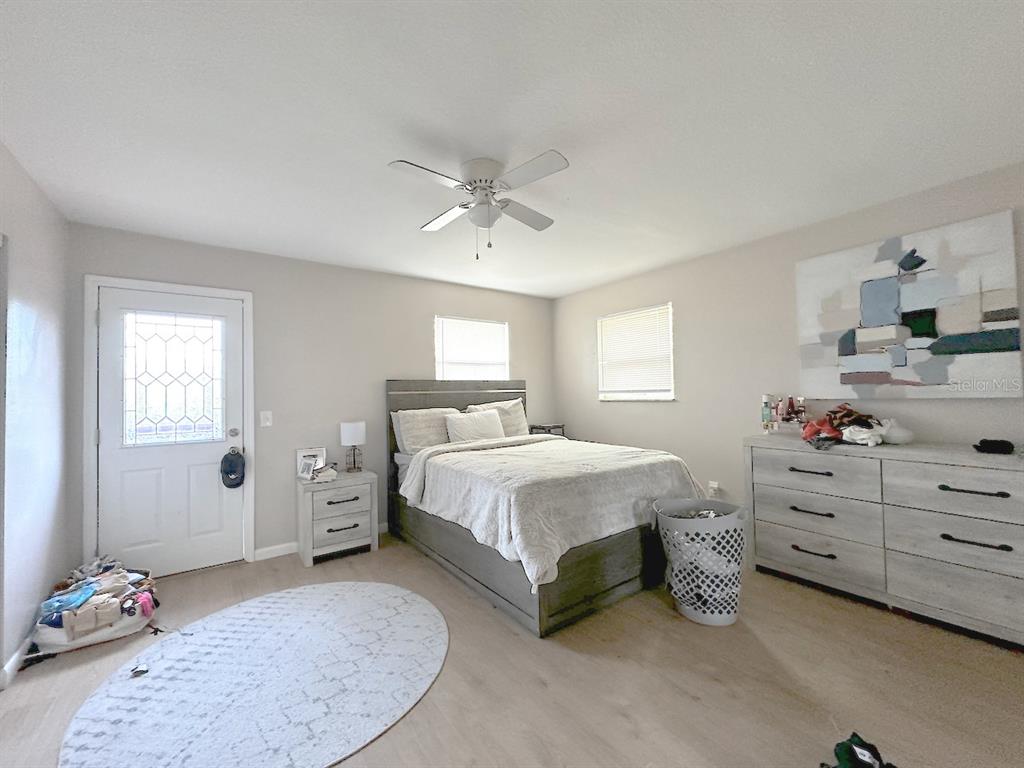 1713 Azalea Court, Unit A Oldsmar, FL 34677 - Photo 11 of 38 a spacious bedroom with a bed and window