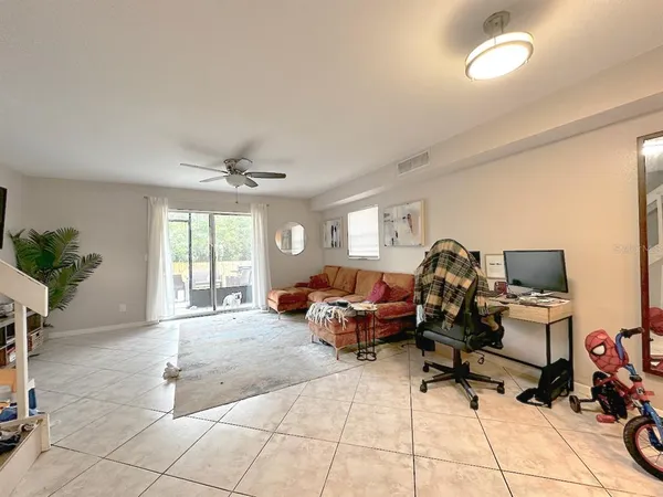 a living room with furniture and a window