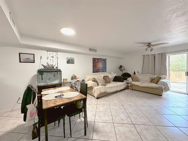 a living room with furniture and a table
