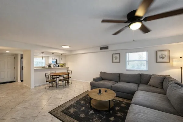 a living room with furniture and a table