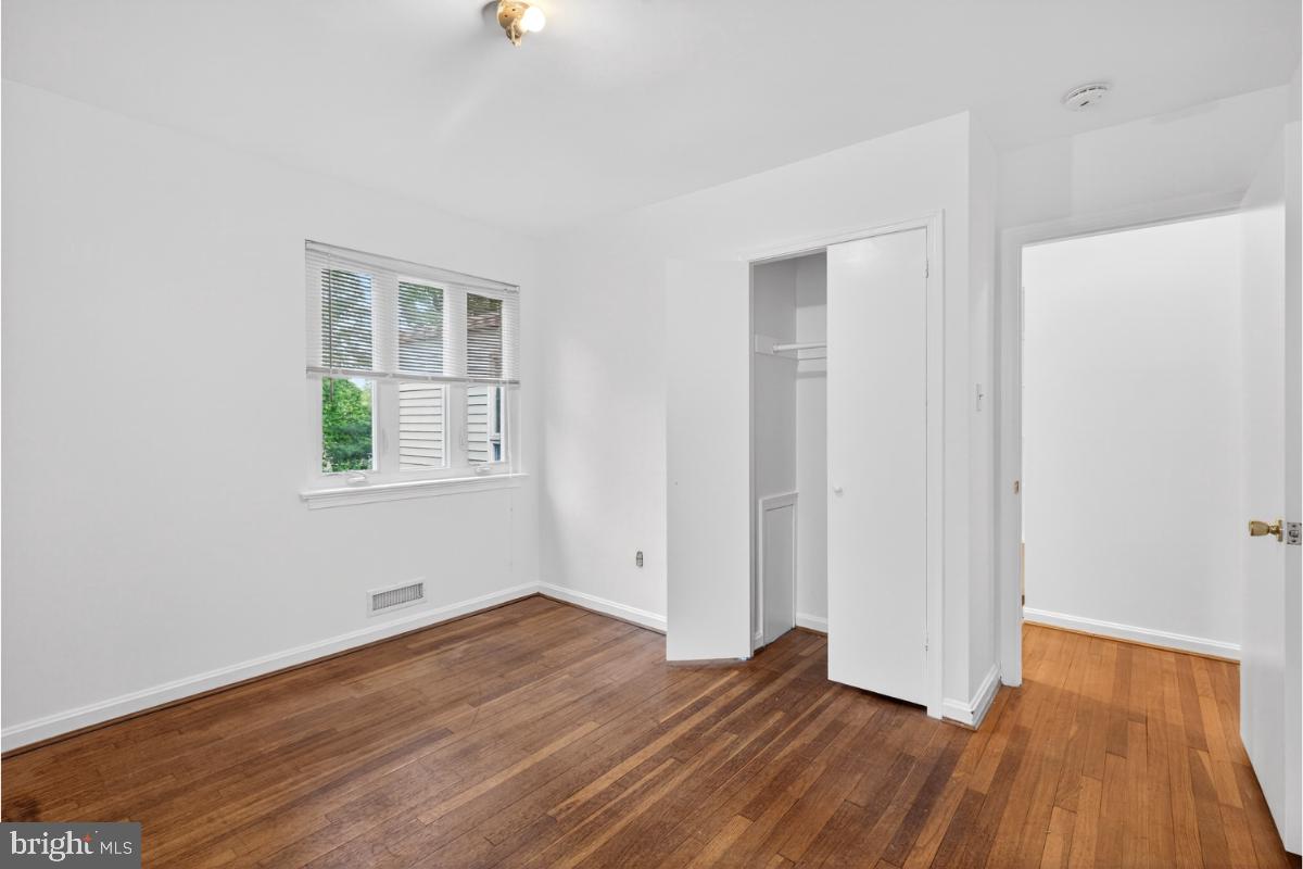 4068 Adams Drive Silver Spring, MD 20902 - Photo 14 of 43 an empty room with wooden floor and windows