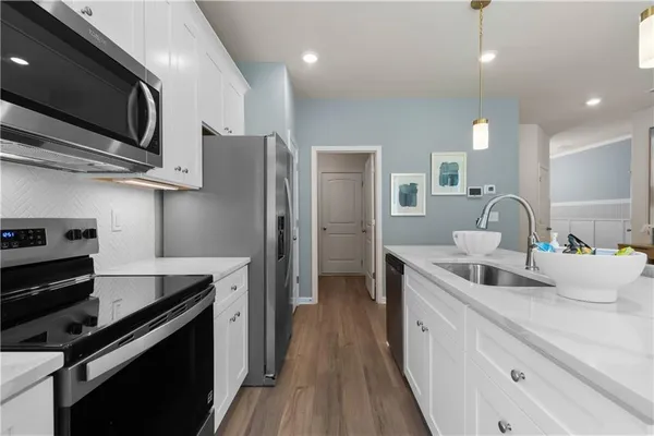 a kitchen with a stove and a microwave