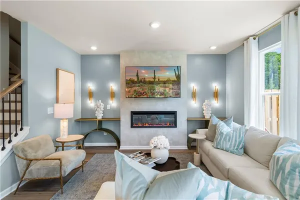 a living room with furniture and a fireplace