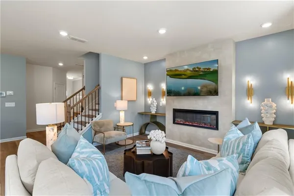 a kitchen with a table chairs refrigerator and cabinets