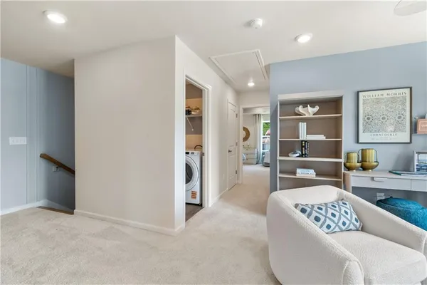 a bedroom with a bed couch and window