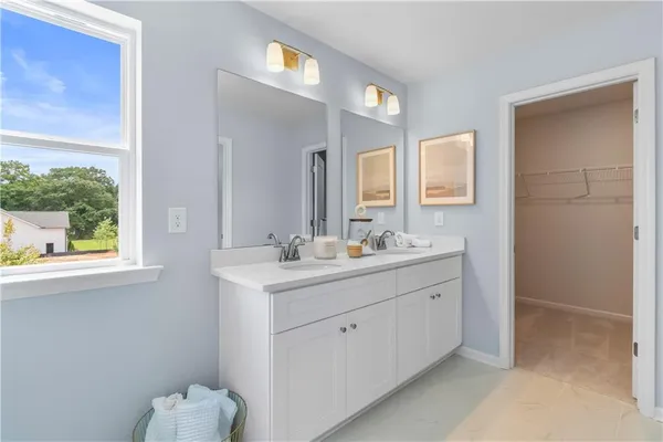 a bathroom with a glass shower door
