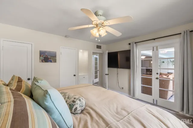 a bathroom with a granite countertop sink and a bathtub