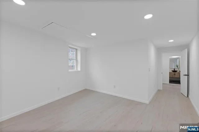 a view of a big room with windows and cabinet