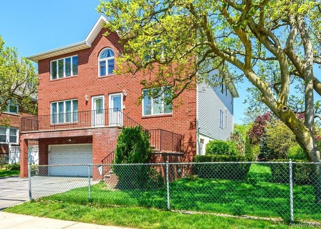 315 Washington Avenue, Unit 1 New Rochelle, NY 10801 - Photo 11 of 29 a front view of a house with plants and garden