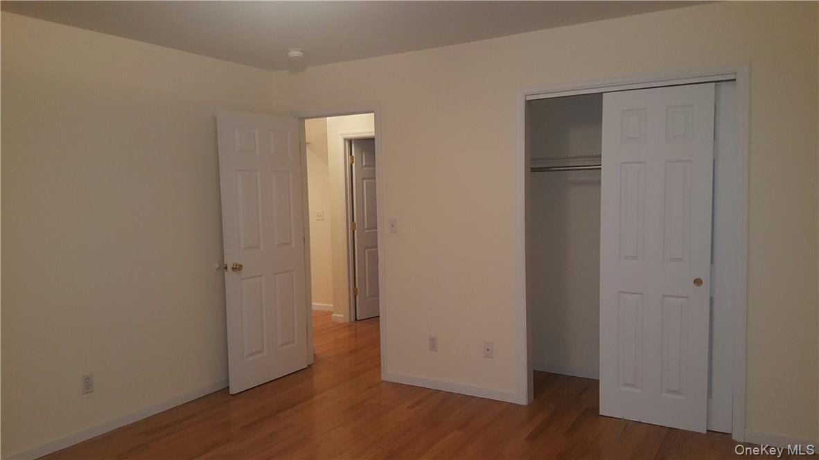 315 Washington Avenue, Unit 1 New Rochelle, NY 10801 - Photo 12 of 29 a view of an empty room with wooden floor