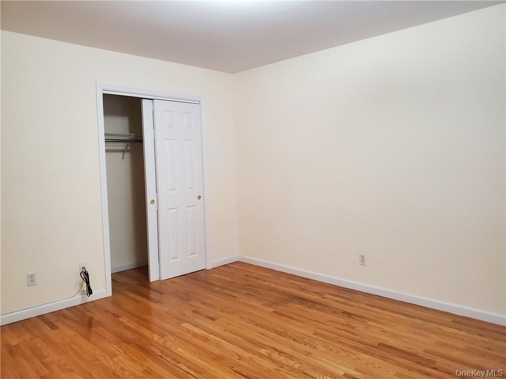 315 Washington Avenue, Unit 1 New Rochelle, NY 10801 - Photo 13 of 29 a view of empty room with wooden floor