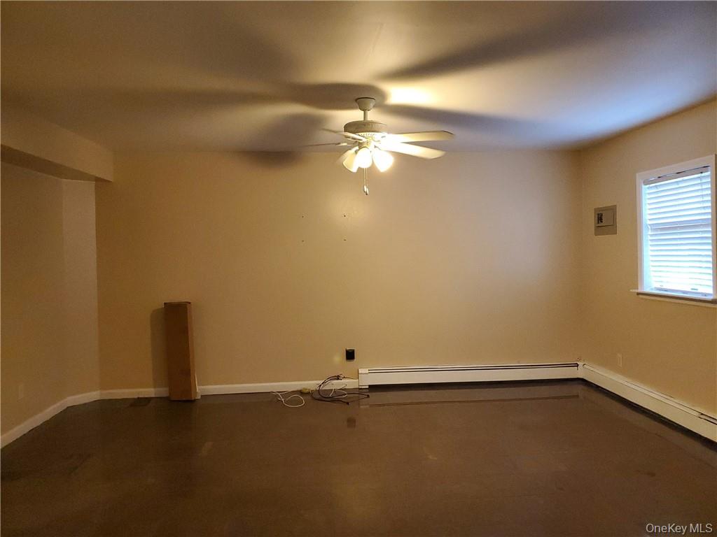 315 Washington Avenue, Unit 1 New Rochelle, NY 10801 - Photo 22 of 29 a view of a room with ceiling fan and windows