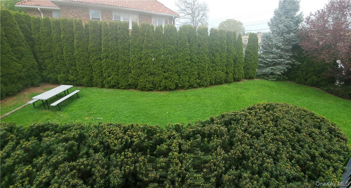 315 Washington Avenue, Unit 1 New Rochelle, NY 10801 - Photo 7 of 29 a view of a garden with a building