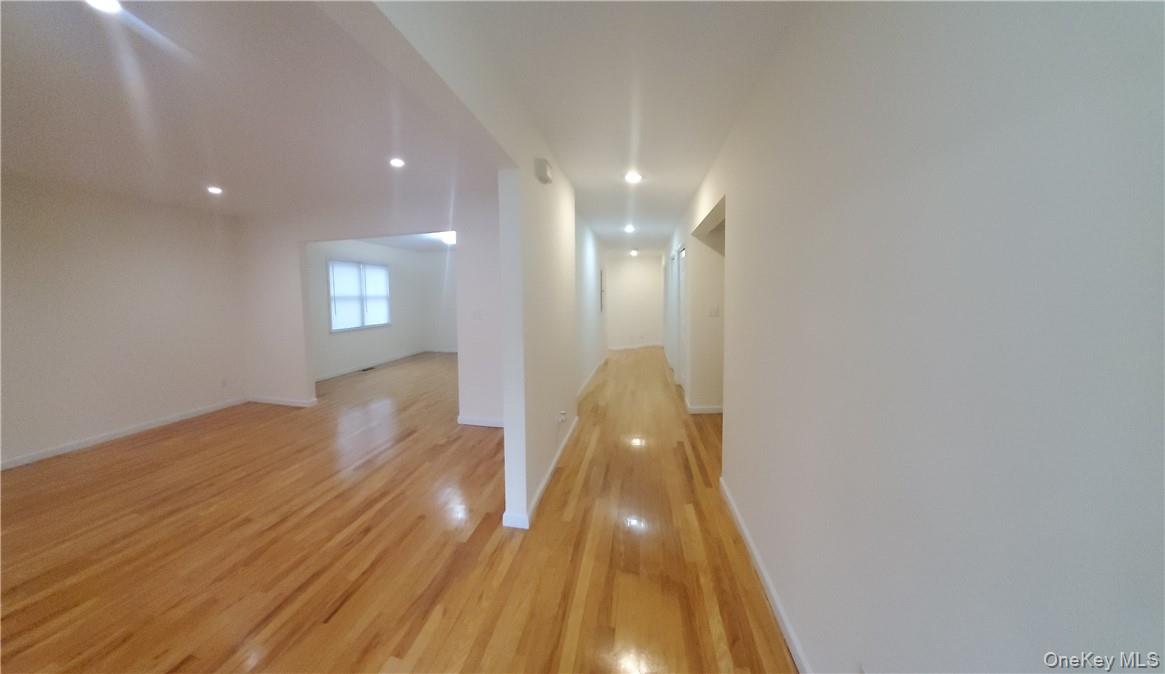 315 Washington Avenue, Unit 1 New Rochelle, NY 10801 - Photo 10 of 29 a view of a room with wooden floor and staircase
