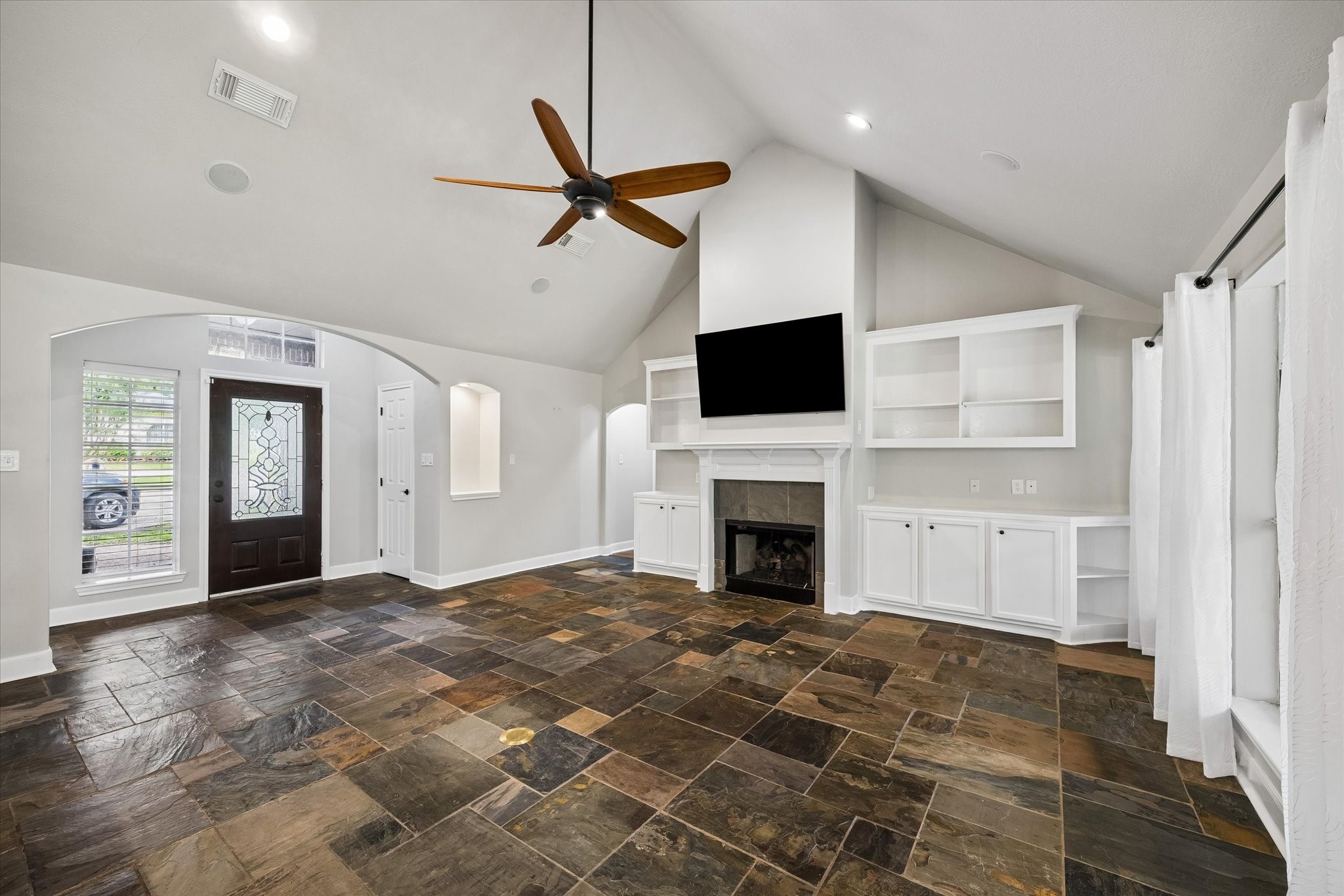 109 Dawns Edge Conroe, TX 77356 - Photo 4 of 24 a view of empty room with a fireplace and fan