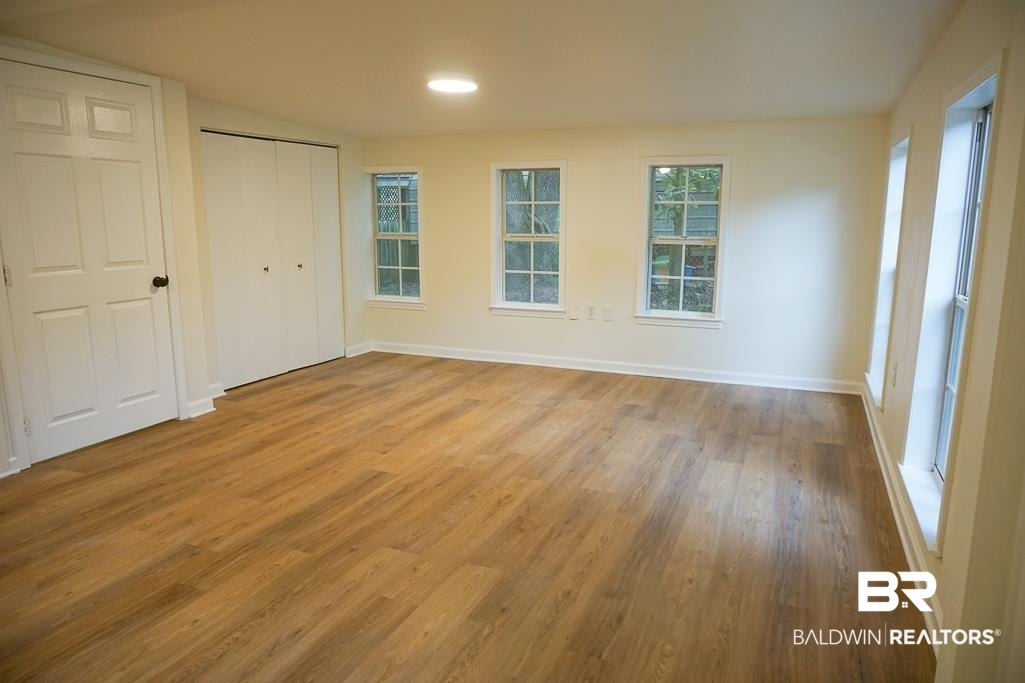 4734 Kirkwell Drive Mobile, AL 36619 - Photo 9 of 18 Unfurnished bedroom with light hardwood / wood-style flooring