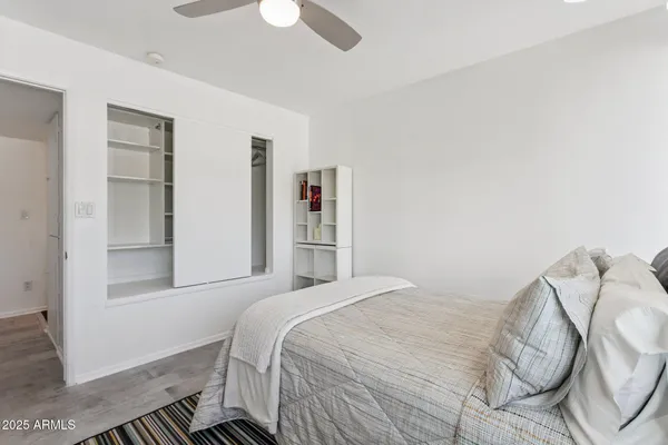 a bedroom with a bed and a window