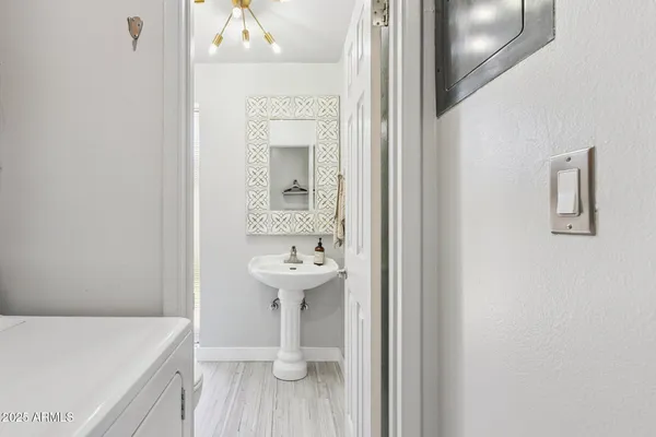 a bathroom with a sink and mirror