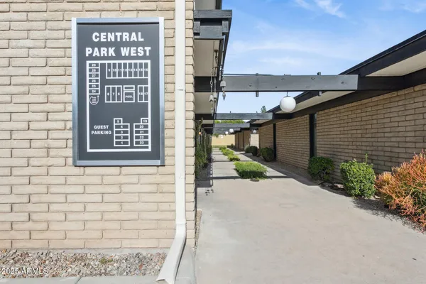 a view of a brick building with a sign on the wall