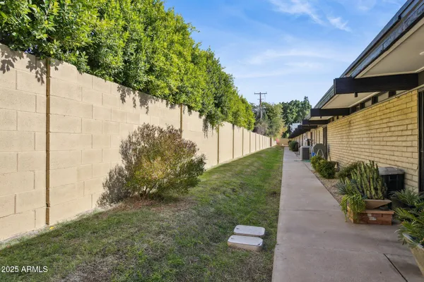 a backyard of a house with lots of green space