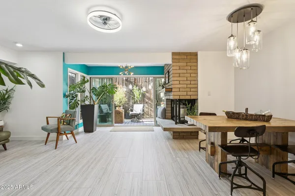 a view of a dining room with furniture window and wooden floor