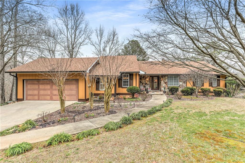 5000 Ledieu Road Roswell, GA 30075 - Photo 1 of 1 a front view of a house with yard patio and livingroom