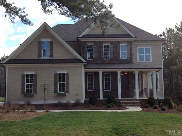 7012 Carries Reach Way Raleigh, NC 27614 - Photo 1 of 5 a front view of a house with a yard