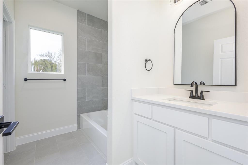 1844 County Road 2320 Terrell, TX 75160 - Photo 13 of 27 a bathroom with a sink and a mirror