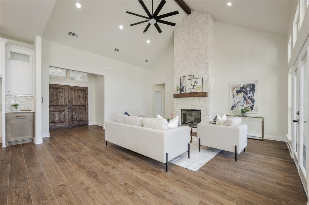 1844 County Road 2320 Terrell, TX 75160 - Photo 24 of 27 a living room with fireplace furniture and a wooden floor