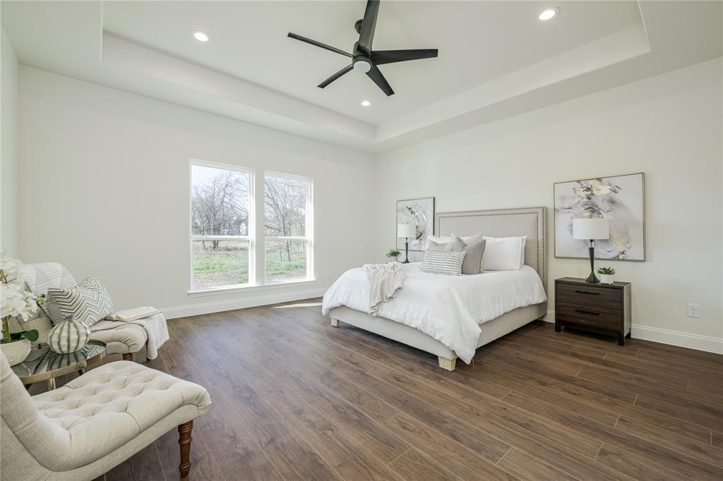 1844 County Road 2320 Terrell, TX 75160 - Photo 25 of 27 a bed room with a bed and a couch
