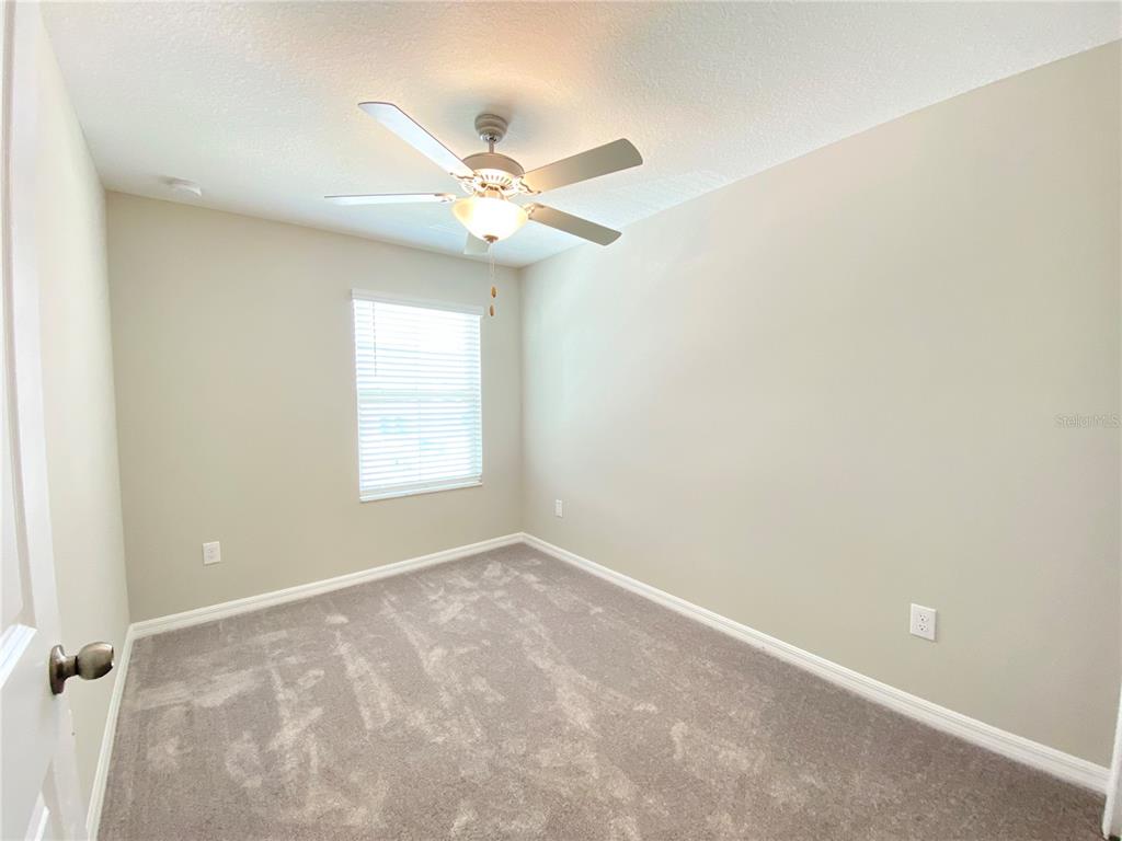3523 Bellmeade Court Wesley Chapel, FL 33543 - Photo 14 of 22 a view of an empty room with a window
