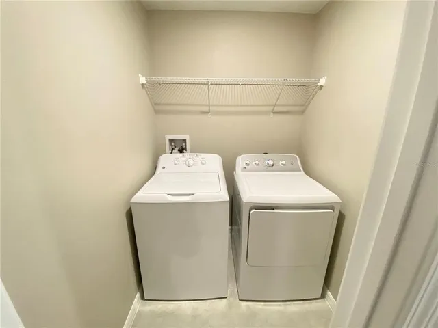 a utility room with dryer and washer