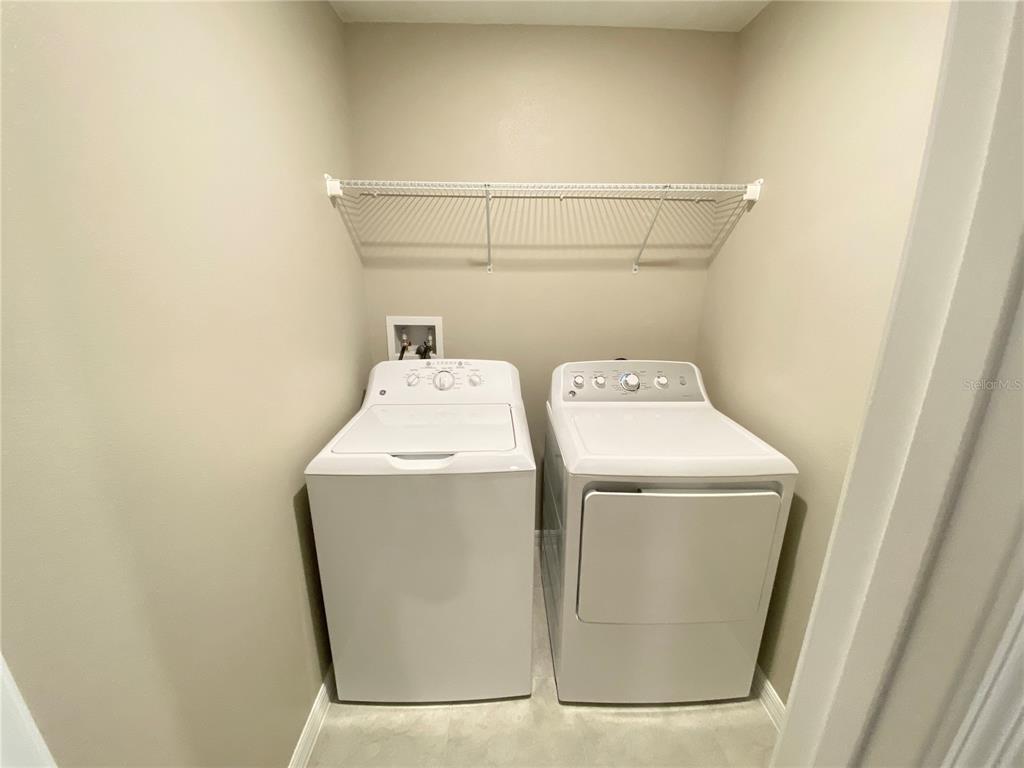 3523 Bellmeade Court Wesley Chapel, FL 33543 - Photo 17 of 22 a utility room with dryer and washer