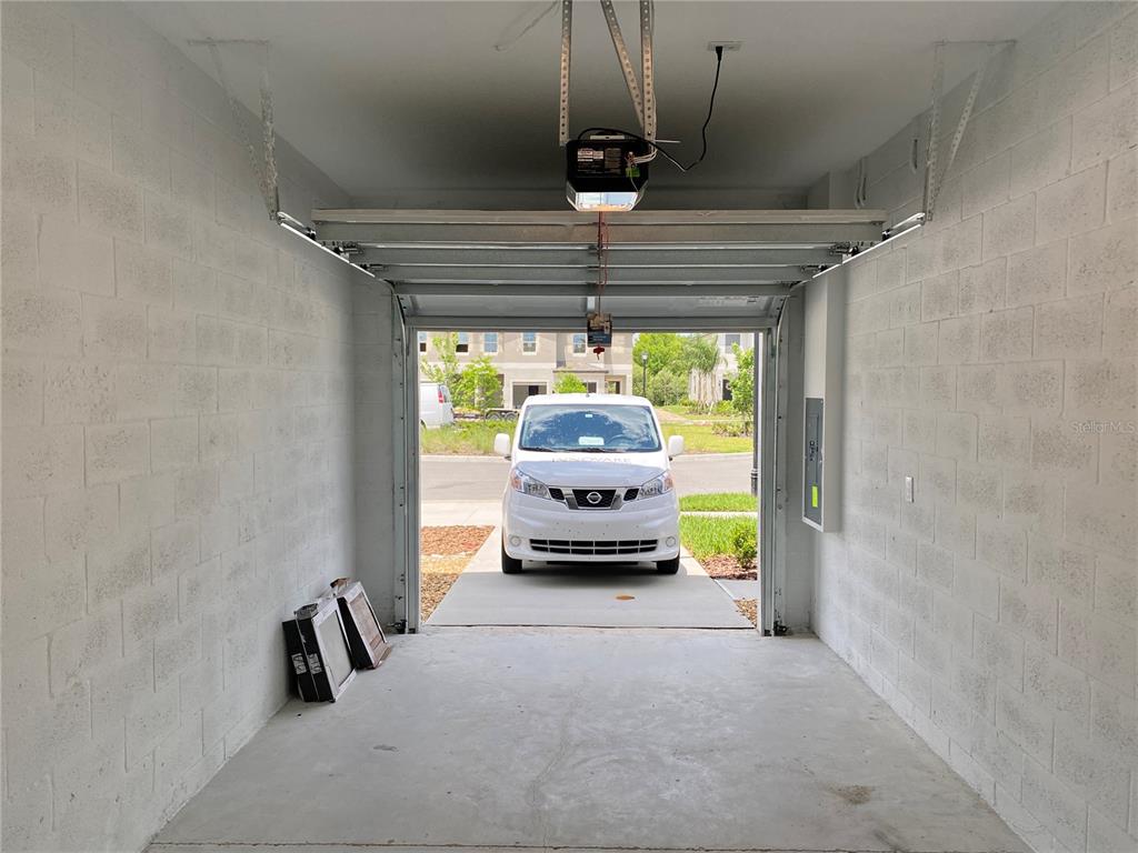 3523 Bellmeade Court Wesley Chapel, FL 33543 - Photo 18 of 22 a hallway with a chandelier