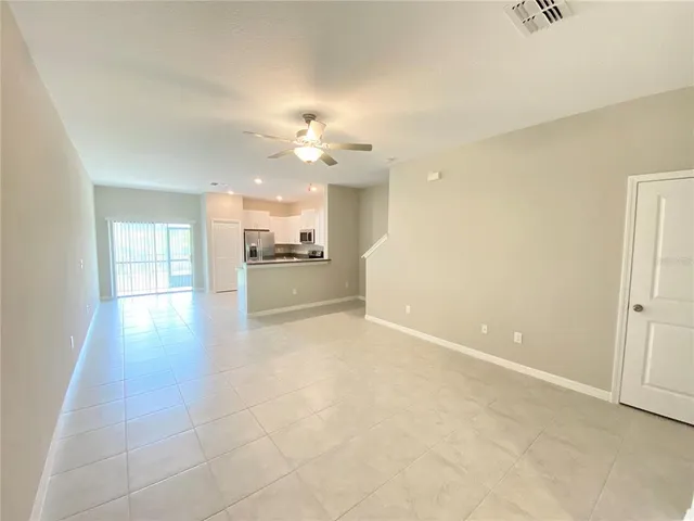a view of a kitchen with a sink and a window
