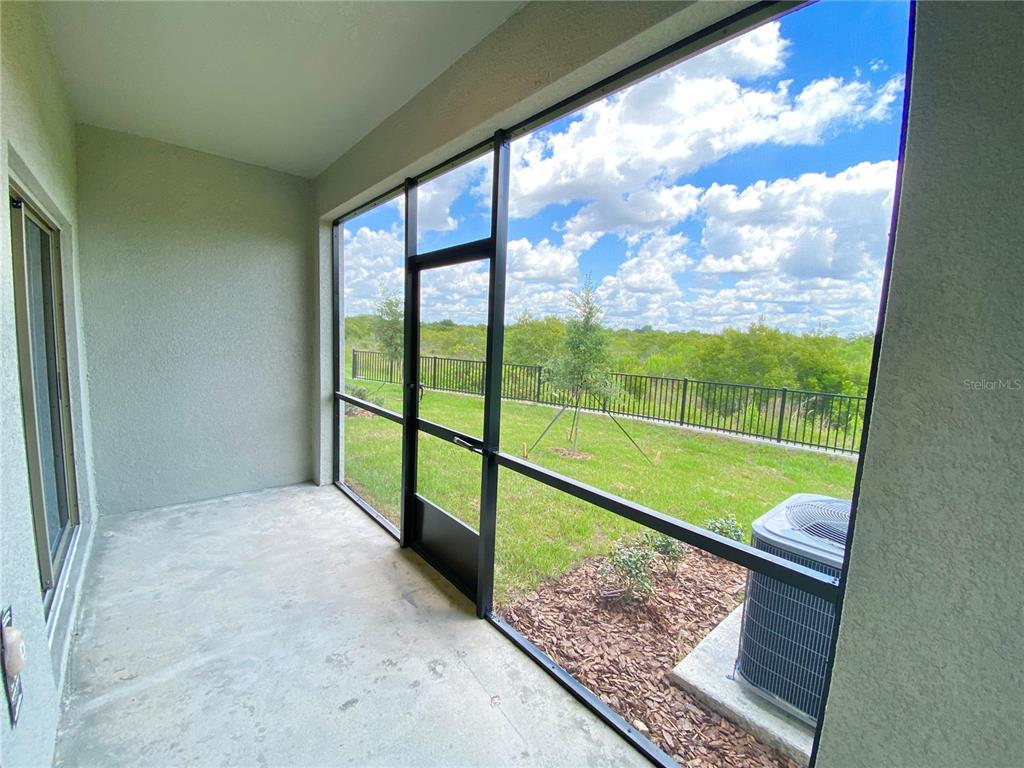 3523 Bellmeade Court Wesley Chapel, FL 33543 - Photo 21 of 22 a view of a porch with a yard