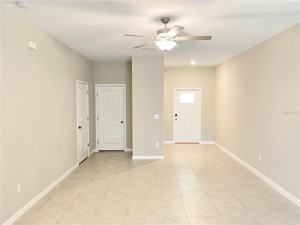 3523 Bellmeade Court Wesley Chapel, FL 33543 - Photo 3 of 22 wooden floor in an empty room