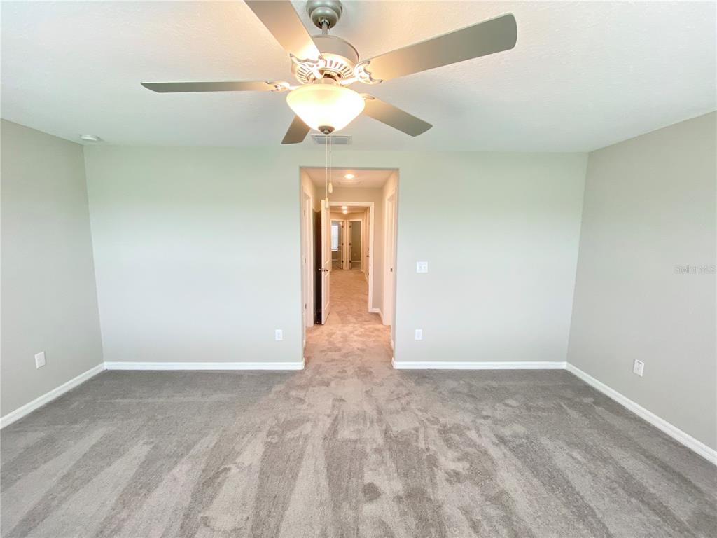 3523 Bellmeade Court Wesley Chapel, FL 33543 - Photo 9 of 22 wooden floor in an empty room