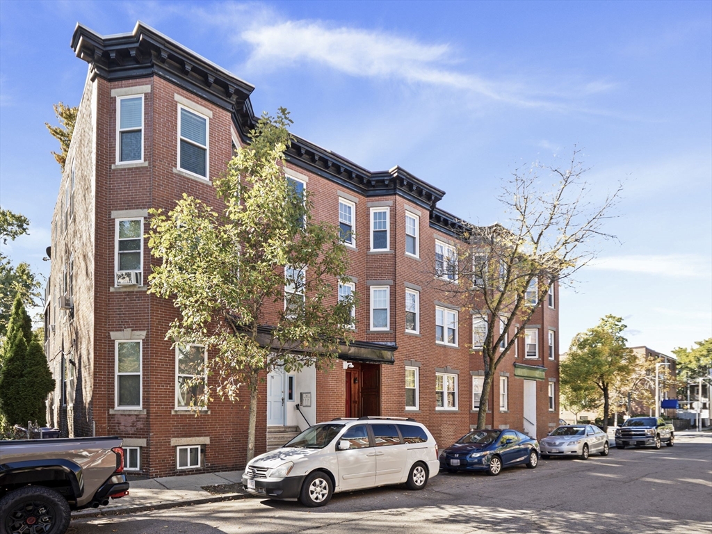 95 Florida Street, Unit 2 Boston, MA 02124 - Photo 27 of 29 a car parked in front of a building
