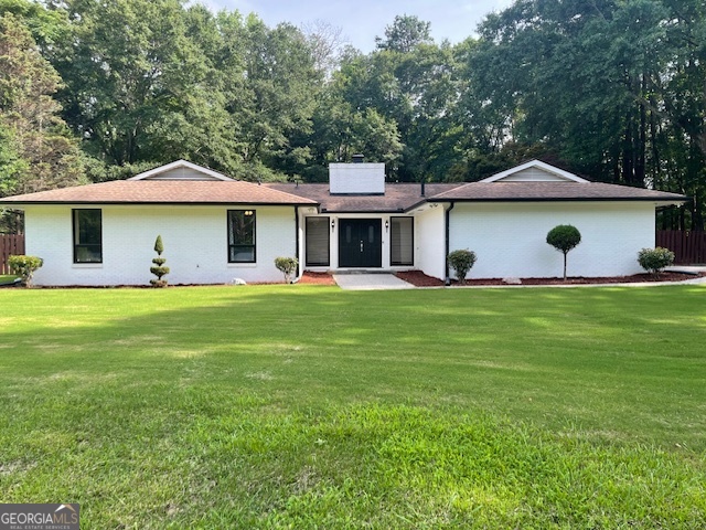 558 Kenwood Road Fayetteville, GA 30214 - Photo 33 of 33 a front view of a house with garden