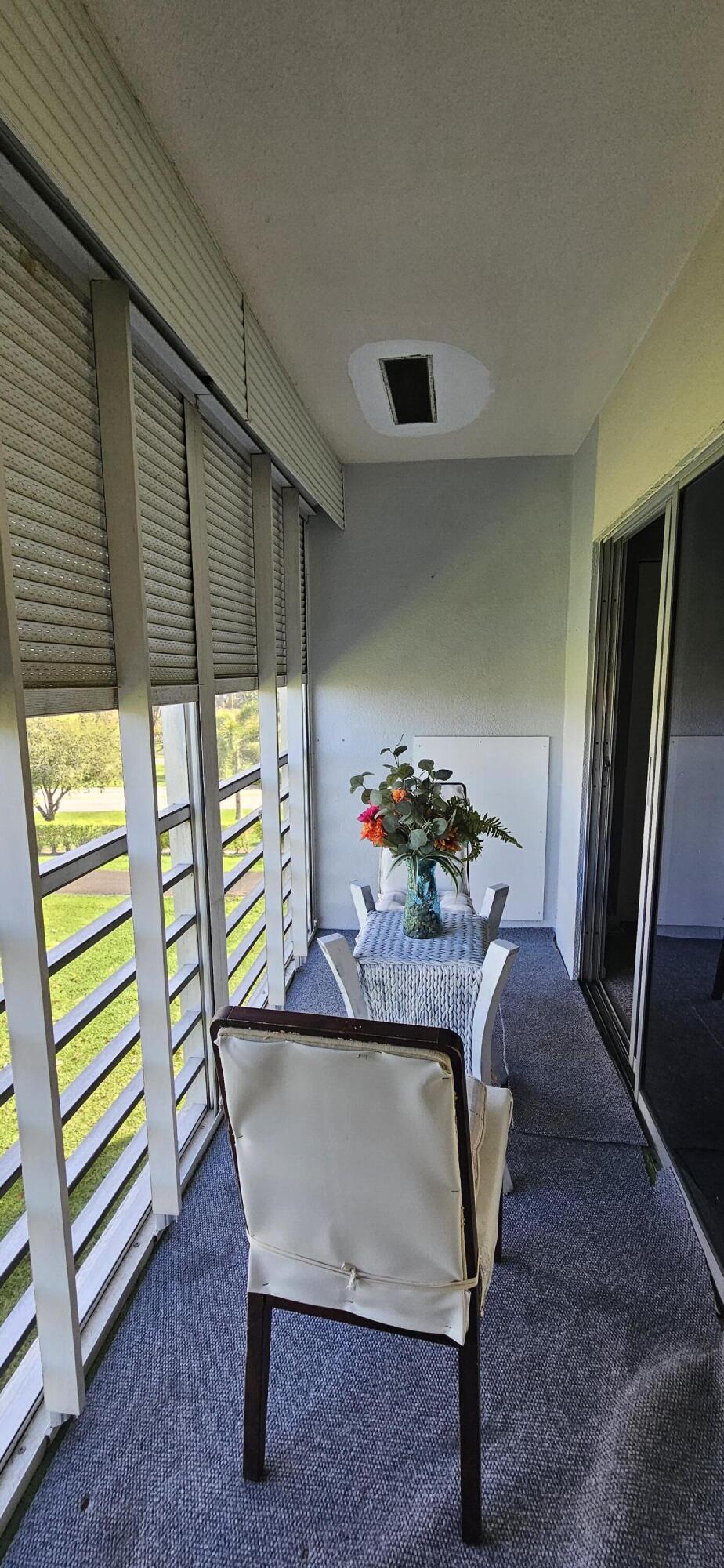198 Preston Way, Unit 198 Boca Raton, FL 33434 - Photo 13 of 16 a living room with furniture and a window